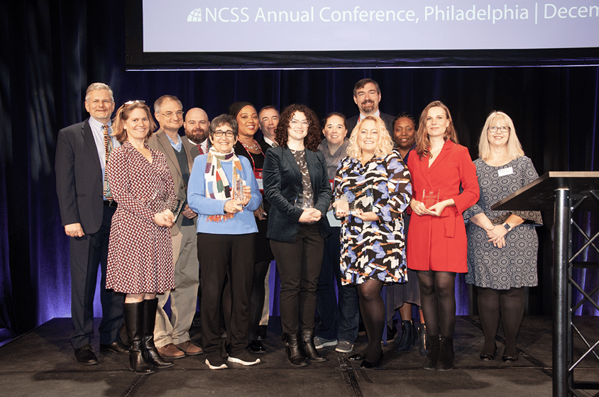 Award Recipients with Awards and Lawrence Paska and Shannon Pugh